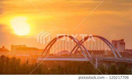 Sunset timelapse above the Bridge with the transport and clouds on the background. Central Asia, Kazakhstan, Astana 120217706