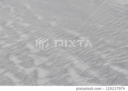 Footprints left on the beach 120217974