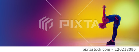 Side view full-length image of elderly man in sportswear training, doing warming up exercises against gradient yellow background in neon light Side view full-length image of elderly man in sportswear training, doing warming up exercises against gradient yellow background in neon light 120218096