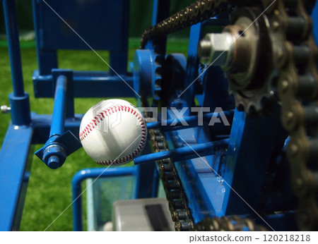 A hard ball set up on a batting machine at the indoor practice field at Mazda Stadium Hiroshima A hard ball set up on a batting machine at the indoor practice field at Mazda Stadium Hiroshima 120218218