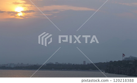 Sunset near Hidirlik tower in Kas town in Turkey timelapse with view of harbor marine bay is a old city 120218388