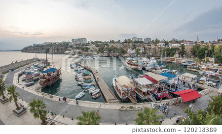 Aerial view of yacht harbor and red house roofs in Old town day to night timelapse Antalya, Turkey. Aerial view of yacht harbor and red house roofs in Old town day to night timelapse Antalya, Turkey. 120218389