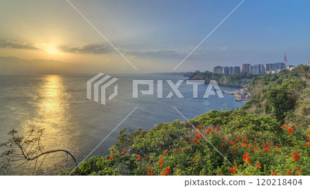 Seascape timelapse of high mountains over clear sunset sky in Turkey 120218404