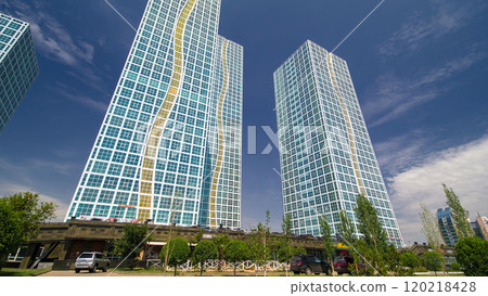 Modern towers of residential complex near Ishim River timelapse hyperlapse in Astana 120218428