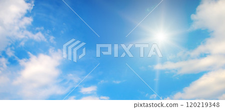 Blue sky with white clouds and bright sun. 120219348