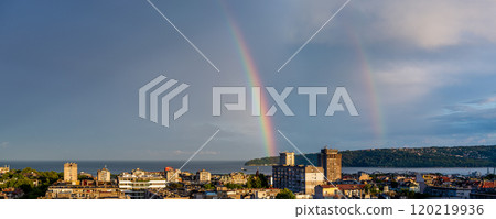 Double rainbow over seaside town at summer evening. Double rainbow over seaside town at summer evening. 120219936