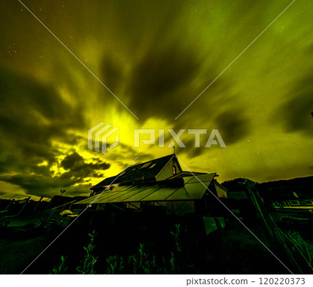 The Aurora Borealis, the northern lights, showing up above bungalow in County Donegal, Ireland The Aurora Borealis, the northern lights, showing up above bungalow in County Donegal, Ireland 120220373
