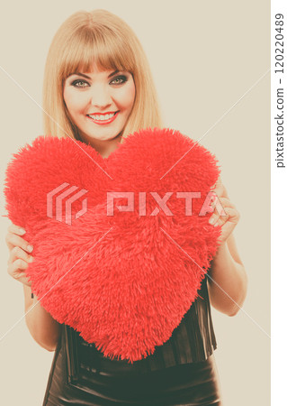 Woman gorgeous girl holding red heart love symbol 120220489