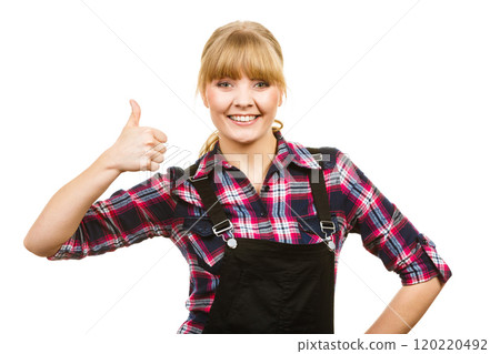 Woman in dungarees showing thumb up Woman in dungarees showing thumb up 120220492