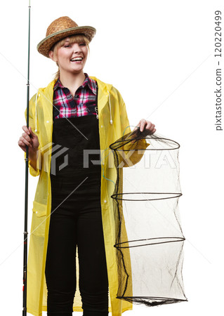 Happy woman holding fishing rod and keepnet Happy woman holding fishing rod and keepnet 120220499