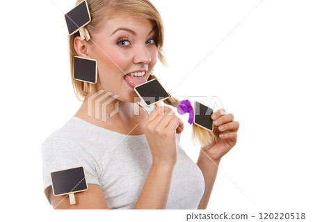 Teenage girl biting little school blackboards 120220518