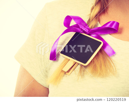 Teenage girl having little blackboard in hair Teenage girl having little blackboard in hair 120220519