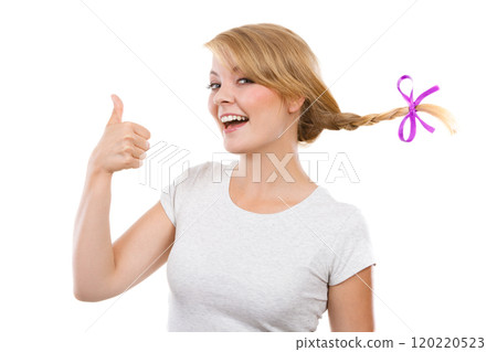 Teenage girl in braid hair making happy face Teenage girl in braid hair making happy face 120220523