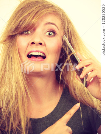 Crazy young woman talking on phone 120220529