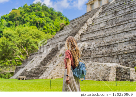 Female tourist exploring the ancient pyramids of Palenque, Mexico, surrounded by dense jungle. Cultural heritage and adventure travel concept Female tourist exploring the ancient pyramids of Palenque, Mexico, surrounded by dense jungle. Cultural heritage and adventure travel concept 120220969