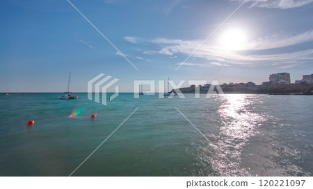 Seascape from the deserted shore to the caspian sea with blue sky and roaring waves timelapse 120221097