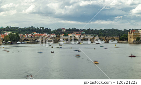 View of the city Prague in Czech Republic with colorful paddle boats timelapse on the Vltava river on a beautiful day 120221222
