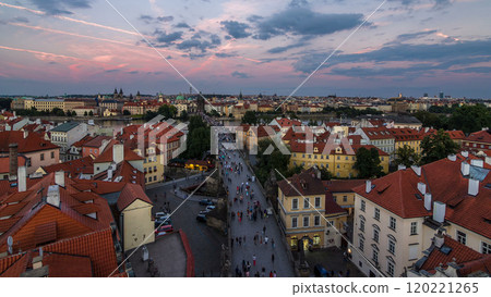 Aerial view of the Old Town architecture and Charles Bridge over Vltava river day to night timelapse in Praha 120221265