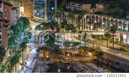 Fontvieille night timelapse - new district of Monaco. Boats, yachts in harbor and a high-rise apartment complex. 120221452