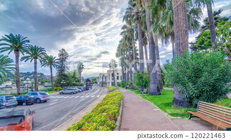 Evening view to palms on the center street of Beaulieu-sur-Mer timelapse hyperlapse. 120221463