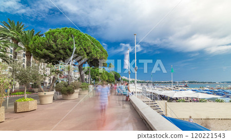 People walking at waterfront near famous La Croisette Boulevard timelapse hyperlapse. French Riviera. 120221543