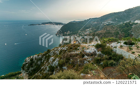 Day to night timelapse view of the Mediterranean coastline of the town of Eze village on the French Riviera 120221571