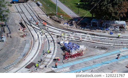 Road construction site with tram tracks repair and maintenance aerial timelapse. Road construction site with tram tracks repair and maintenance aerial timelapse. 120221767