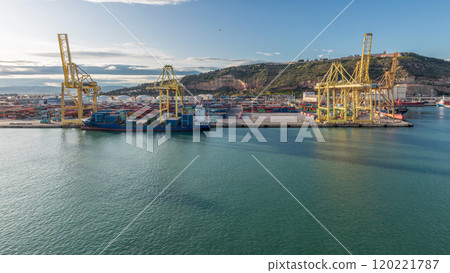 Aerial view of the sea cargo port and container terminal of Barcelona timelapse, Barcelona, Catalonia, Spain. Aerial view of the sea cargo port and container terminal of Barcelona timelapse, Barcelona, Catalonia, Spain. 120221787