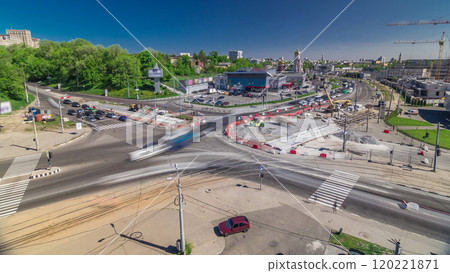 Aerial view of a large city intersection with road construction site urban works timelapse. 120221871