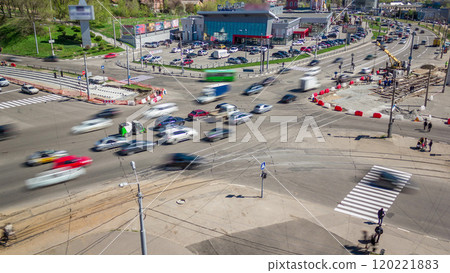 Installing concrete plates by crane on intersection at road construction site timelapse. 120221883