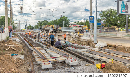 Repair works on the street timelapse. Laying of new tram rails on a city street. 120221897
