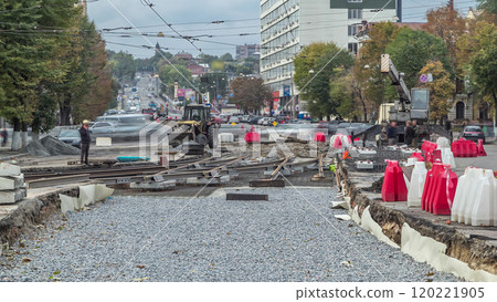 Repair works on the street timelapse. Laying of new tram rails on a city street. 120221905