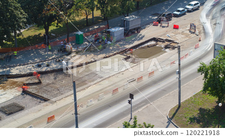 Road construction site with tram tracks repair and maintenance aerial timelapse. Road construction site with tram tracks repair and maintenance aerial timelapse. 120221918