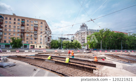 Road construction site with tram tracks repair and maintenance timelapse. 120221921