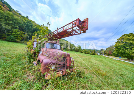 Abandoned Rusty Fire Truck Reclaimed by Nature in Ohio Meadow Eye-Level View 120222350