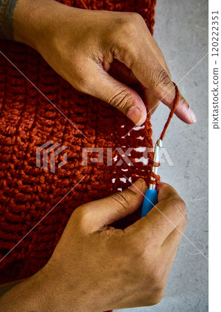 African American Hands Crocheting Rust Yarn Close-Up Motion 120222351
