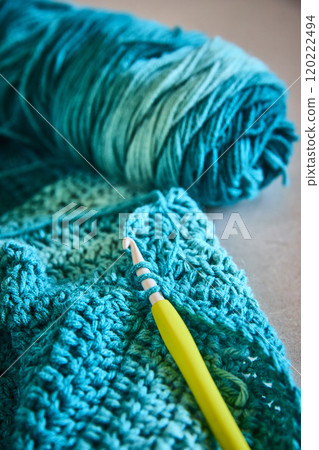 Teal Yarn Crochet Close-Up with Yellow Hook in Motion Teal Yarn Crochet Close-Up with Yellow Hook in Motion 120222494