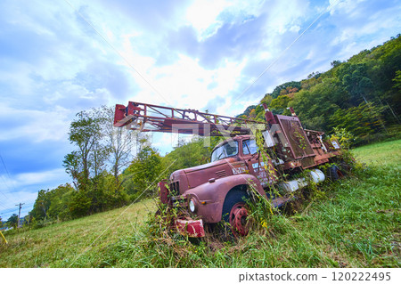 Abandoned Vintage Truck in Grassy Field Low Angle View Abandoned Vintage Truck in Grassy Field Low Angle View 120222495