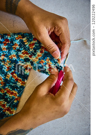 Vibrant Crochet Crafting Hands in Motion Close-Up 120222496