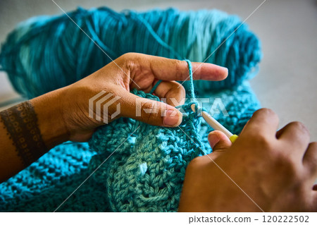 Hands Crocheting Vibrant Yarn with Tattoo Detail Close-Up Hands Crocheting Vibrant Yarn with Tattoo Detail Close-Up 120222502