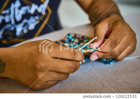 Hands Crocheting Colorful Yarn in Motion Close-Up View Hands Crocheting Colorful Yarn in Motion Close-Up View 120222533