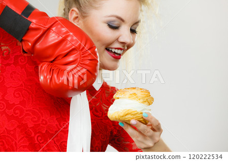 Woman boxing cream cupcake 120222534
