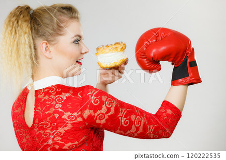 Woman boxing cream cupcake 120222535