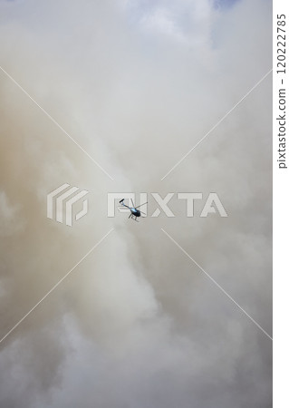 Aerial Fly Through Smoke and Helicopter Over Scrap Yard Fire 120222785