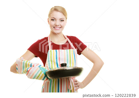 housewife or chef in kitchen apron with skillet frying pan 120222839