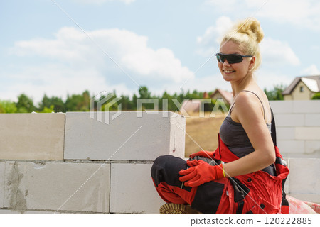 Woman taking break on construction site 120222885