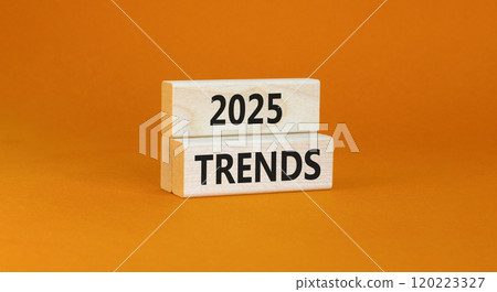 Planning 2025 trends new year symbol. Concept words 2025 Trends on beautiful wooden blocks. Beautiful orange background. Business 2025 trends new year concept. Copy space. 120223327