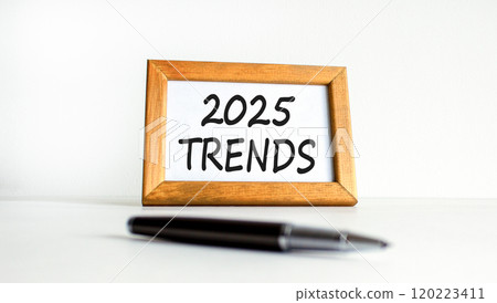 Planning 2025 trends new year symbol. Concept words 2025 Trends on beautiful wooden picture frame. Beautiful white background. Black pen. Business 2025 trends new year concept. Copy space. Planning 2025 trends new year symbol. Concept words 2025 Trends on beautiful wooden picture frame. Beautiful white background. Black pen. Business 2025 trends new year concept. Copy space. 120223411