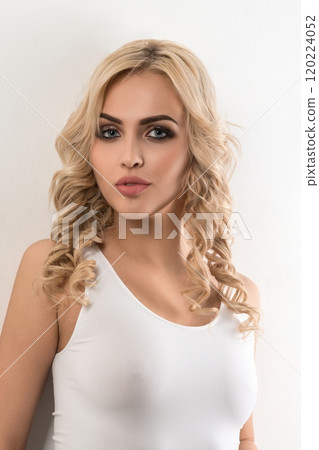Sexy blonde in white top and pants portrait Sexy blonde in white top and pants portrait 120224052