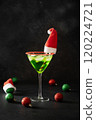 Xmas Grinch Punch in glass decorated sugar rim on black table make of cool lime sherbet. Tasty drink for Christmas holiday. Rim your festive beverages in red sugar. 120224721